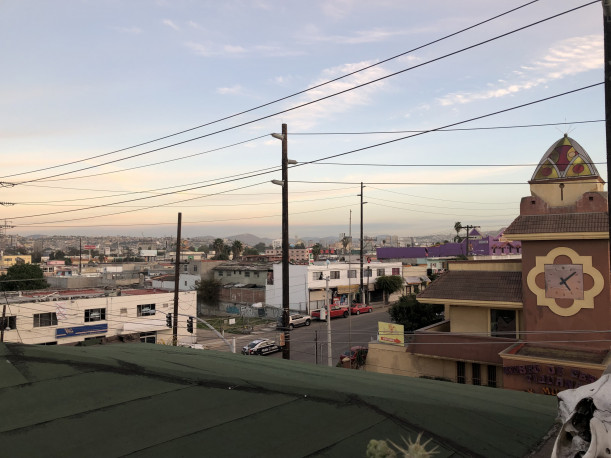 Al Otro's Lado rooftop floor, overlooking the Tijuana horizon.