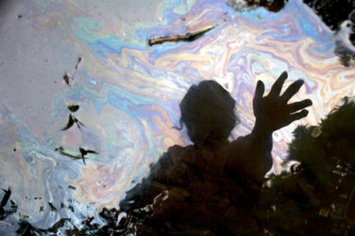 A reflection in a stream in the Ecuadorean Amazon, from the film &quot;Crude.&quot; (Credit: Juan...